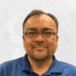 Smiling man with short hair and beard